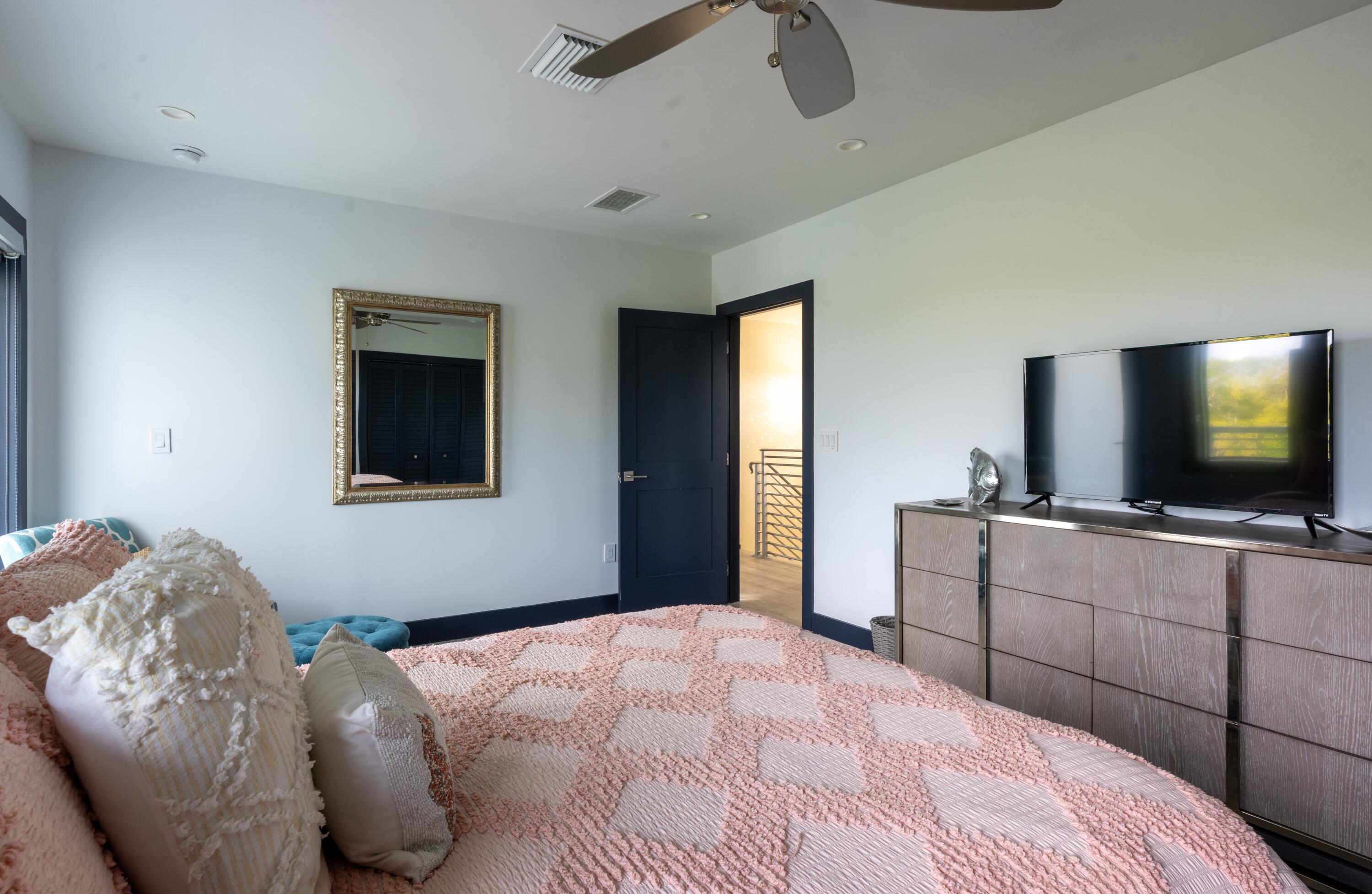 475 Bahia Honda Road Key Largo, FL 33037 - Photo 64 of 134 a bedroom with a bed and a flat screen tv