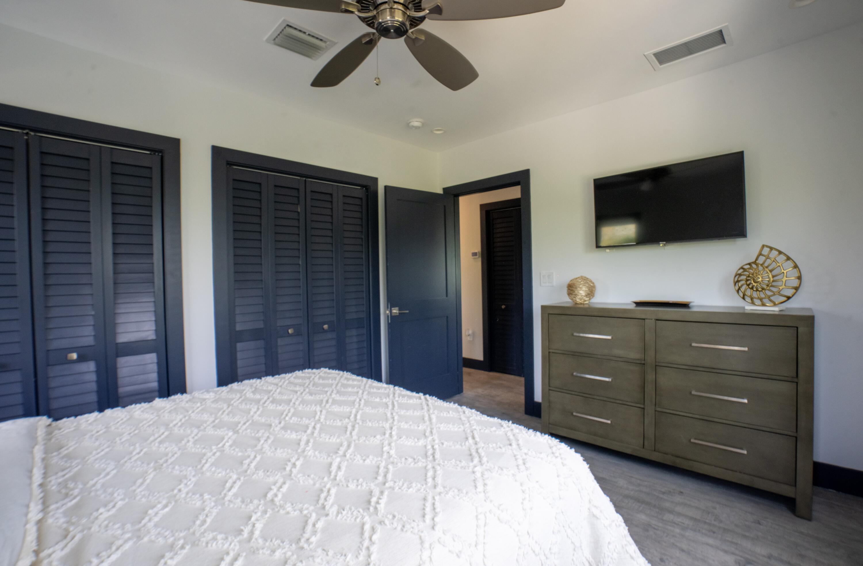 475 Bahia Honda Road Key Largo, FL 33037 - Photo 70 of 134 a bedroom with a bed and a flat screen tv