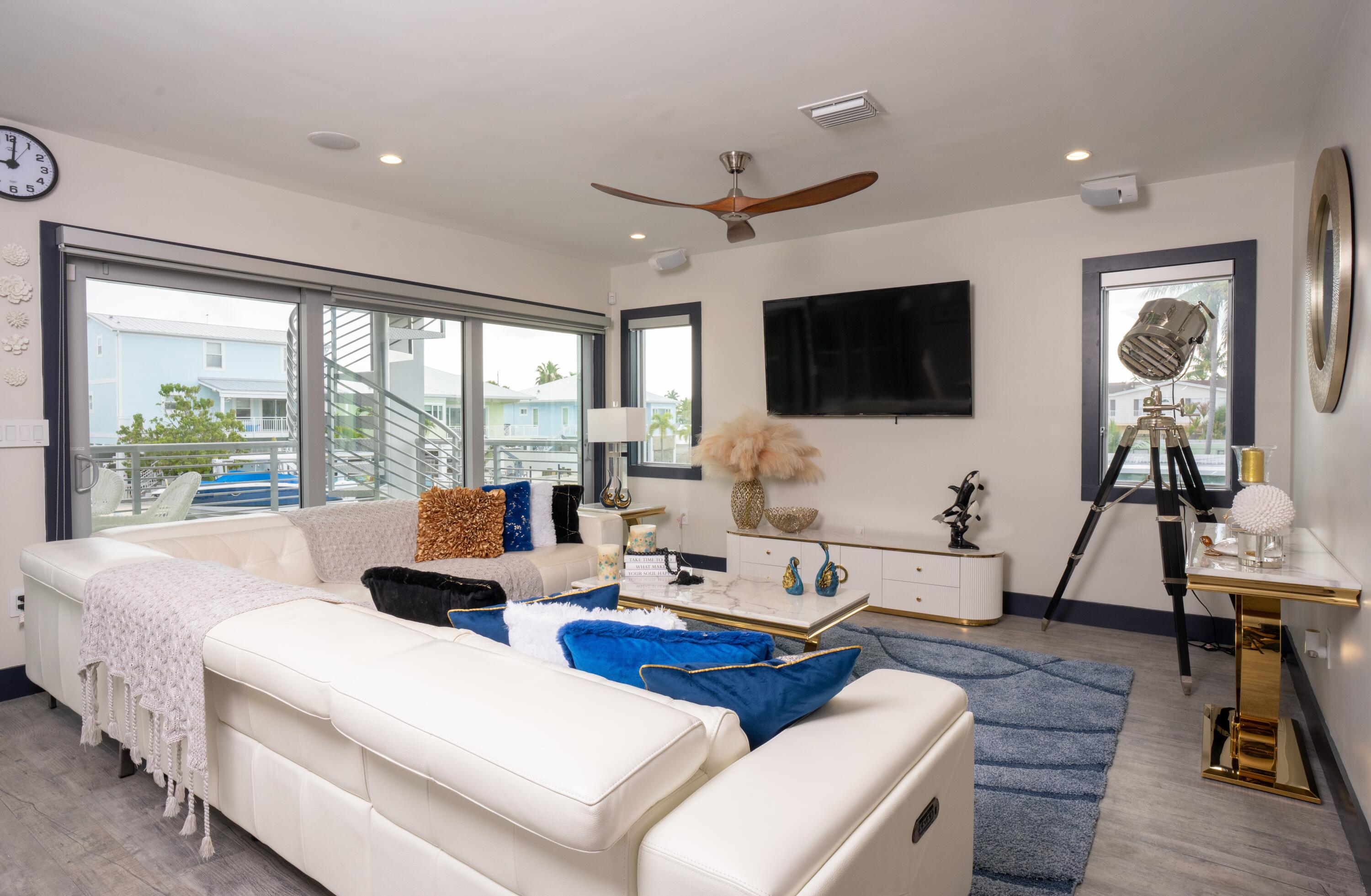 475 Bahia Honda Road Key Largo, FL 33037 - Photo 75 of 134 a living room with furniture a flat screen tv and a large window