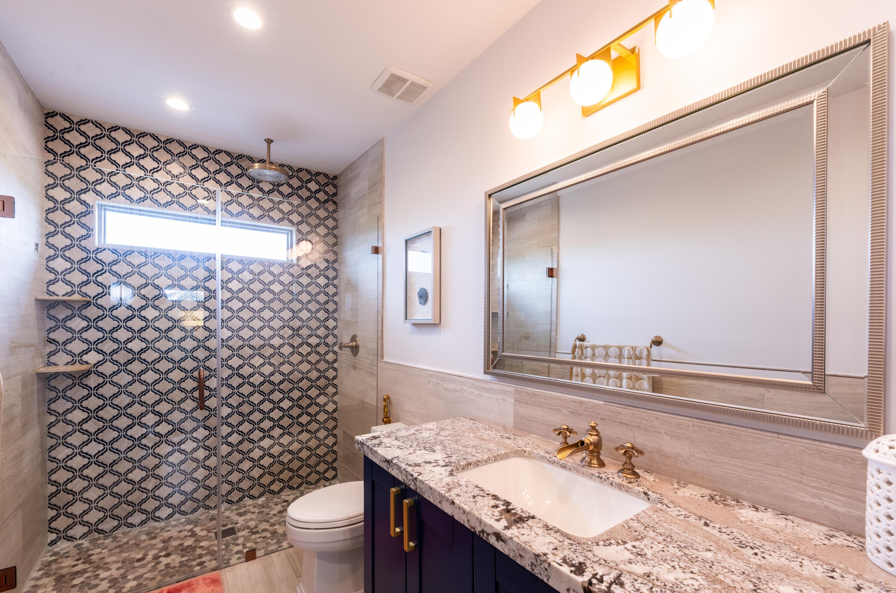 475 Bahia Honda Road Key Largo, FL 33037 - Photo 96 of 134 a bathroom with a granite countertop sink toilet and shower