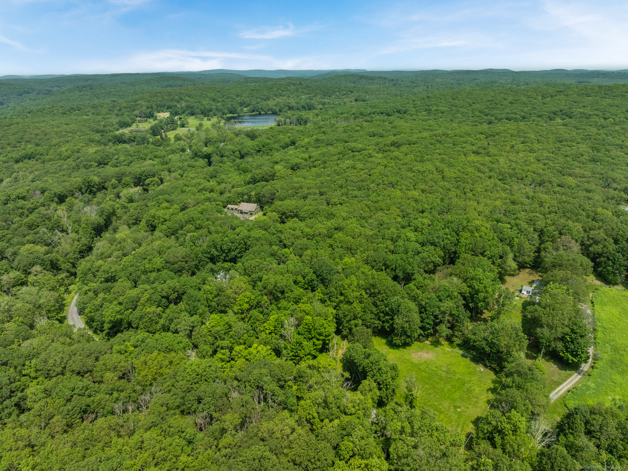 25 Mountain Lake Road Warren, CT 06777 - Photo 11 of 16 a view of a green field with lots of bushes