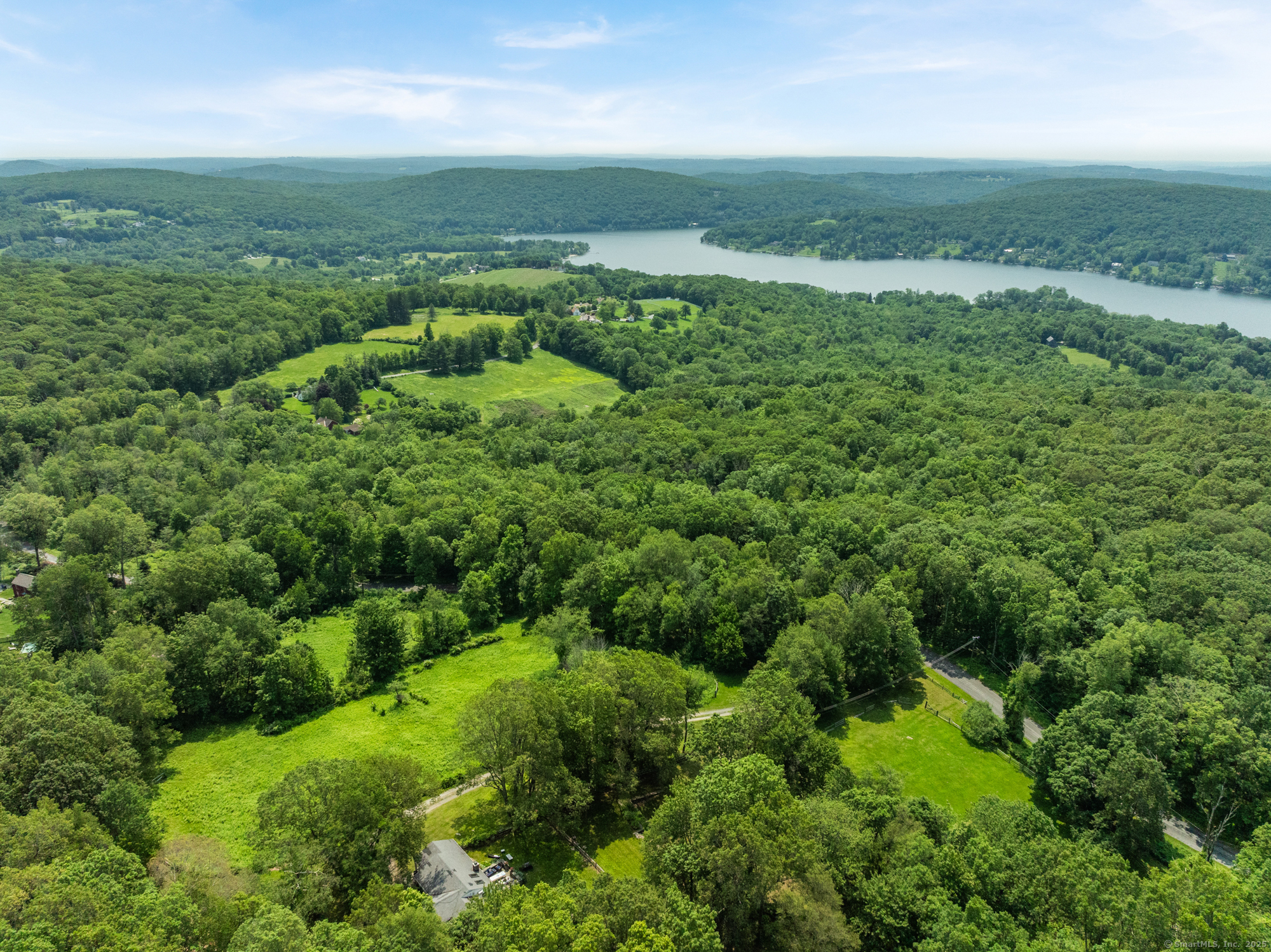 25 Mountain Lake Road Warren, CT 06777 - Photo 13 of 16 an aerial view of huge green field with lots of green space