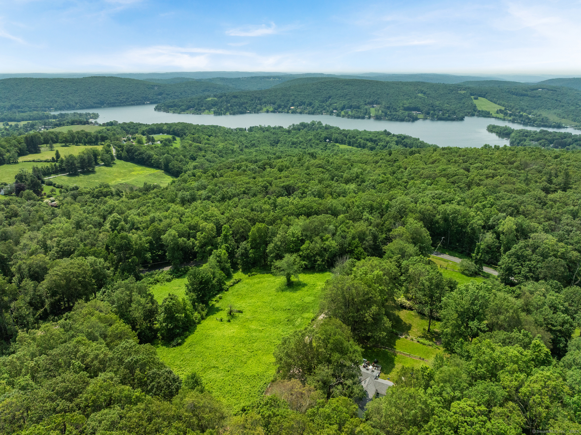 25 Mountain Lake Road Warren, CT 06777 - Photo 15 of 16 an aerial view of huge green field with lots of green space
