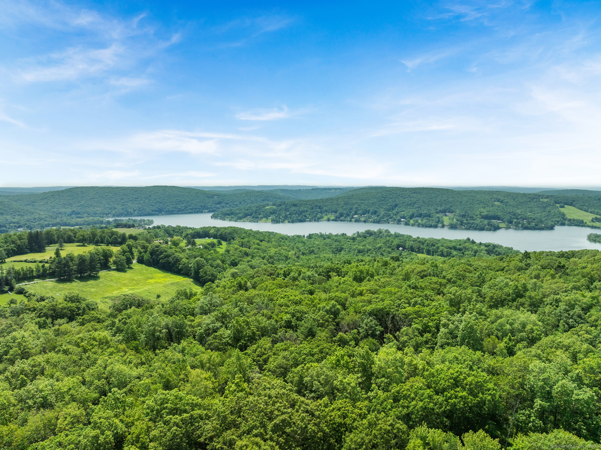 25 Mountain Lake Road Warren, CT 06777 - Photo 3 of 16 an aerial view of residential houses with outdoor space and trees