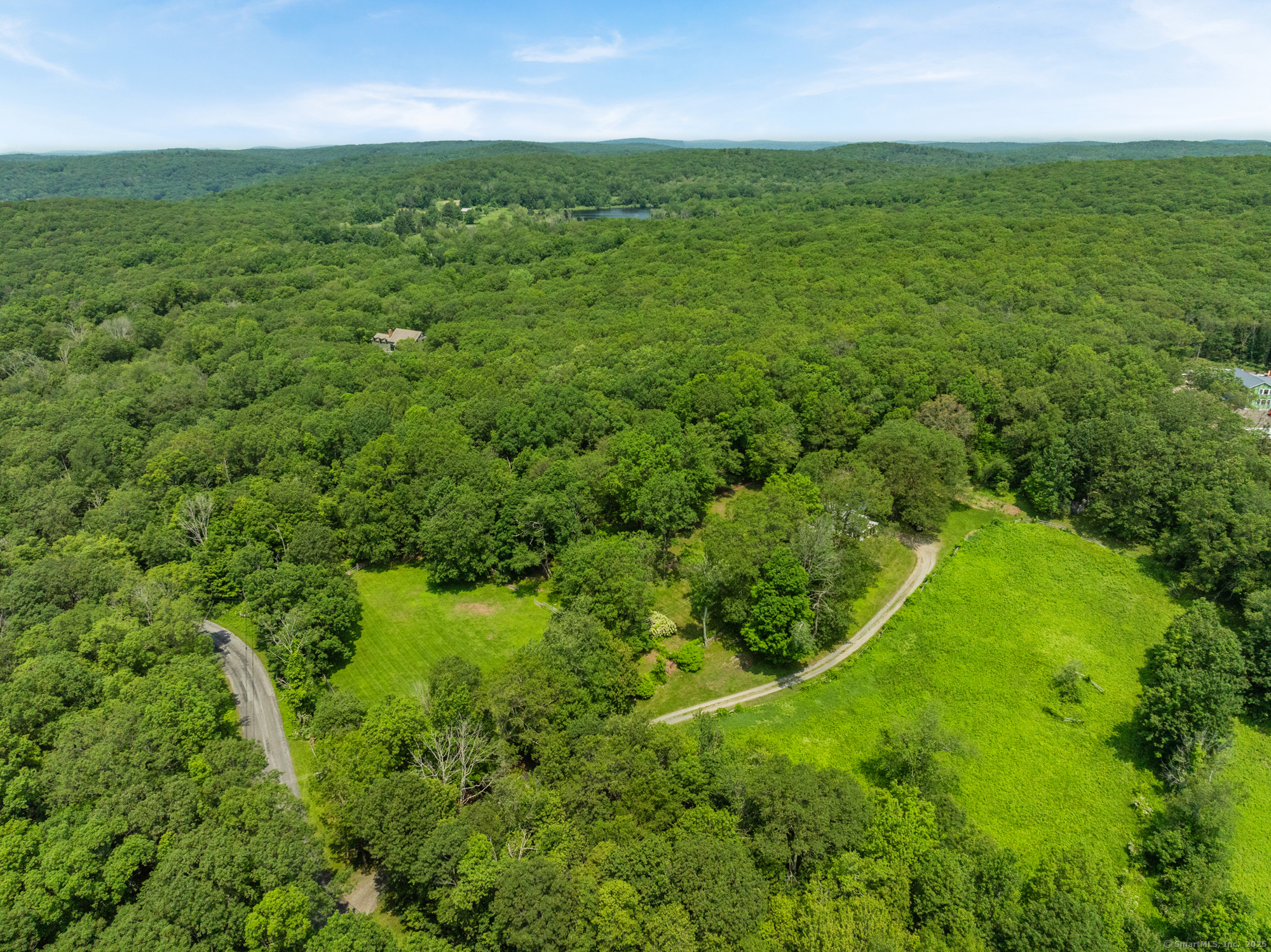 25 Mountain Lake Road Warren, CT 06777 - Photo 7 of 16 an aerial view of residential houses with outdoor space and trees