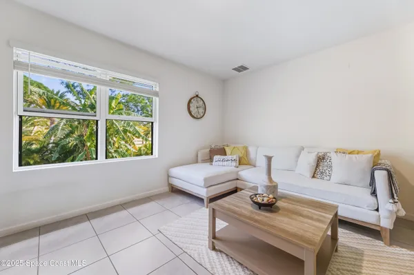 a living room with furniture and a window