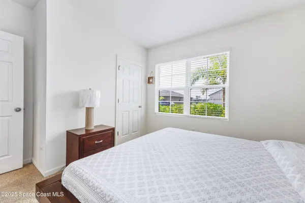a bathroom with a shower sink and mirror