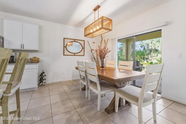 a kitchen with stainless steel appliances granite countertop a sink a stove and cabinets with wooden floor