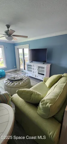 a living room with a couch and a flat screen tv