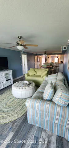 a bedroom with two beds and a flat screen tv