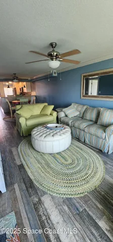 a bedroom with a bed and large window