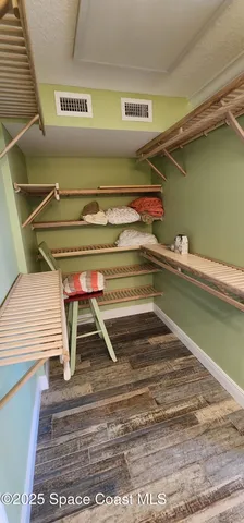 a bedroom with bed and a window