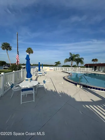 a view of swimming pool from a balcony