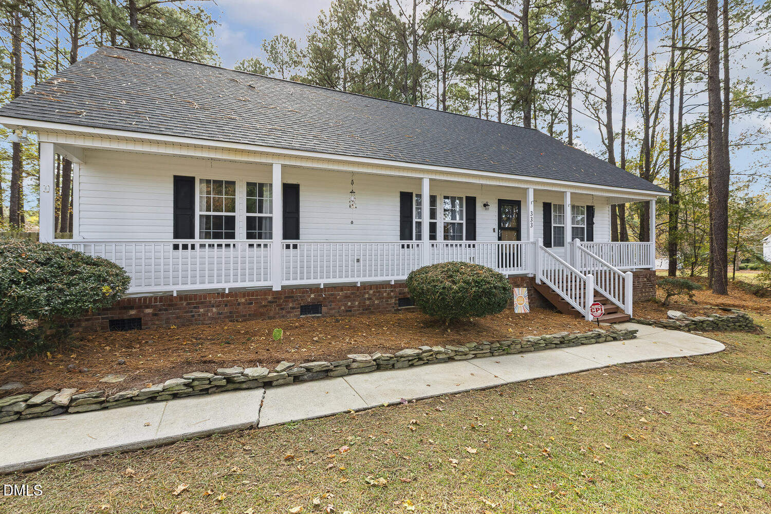 333 Greenleaf Road Angier, NC 27501 - Photo 2 of 42 a front view of a house with garden