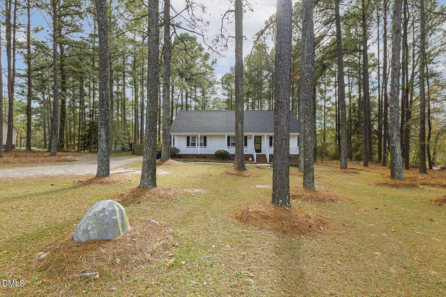 333 Greenleaf Road Angier, NC 27501 - Photo 4 of 42 a swimming pool with lots of tress in front of it
