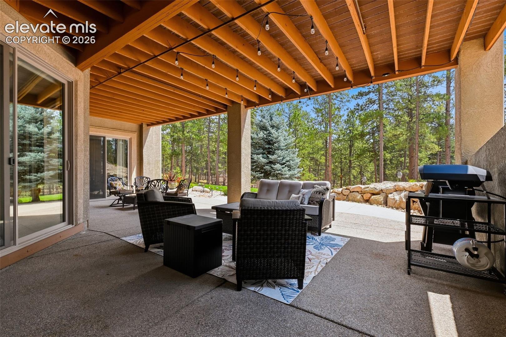 4865 Hidden Rock Road Colorado Springs, CO 80908 - Photo 32 of 50 Basement patio with space for seating and grilling!