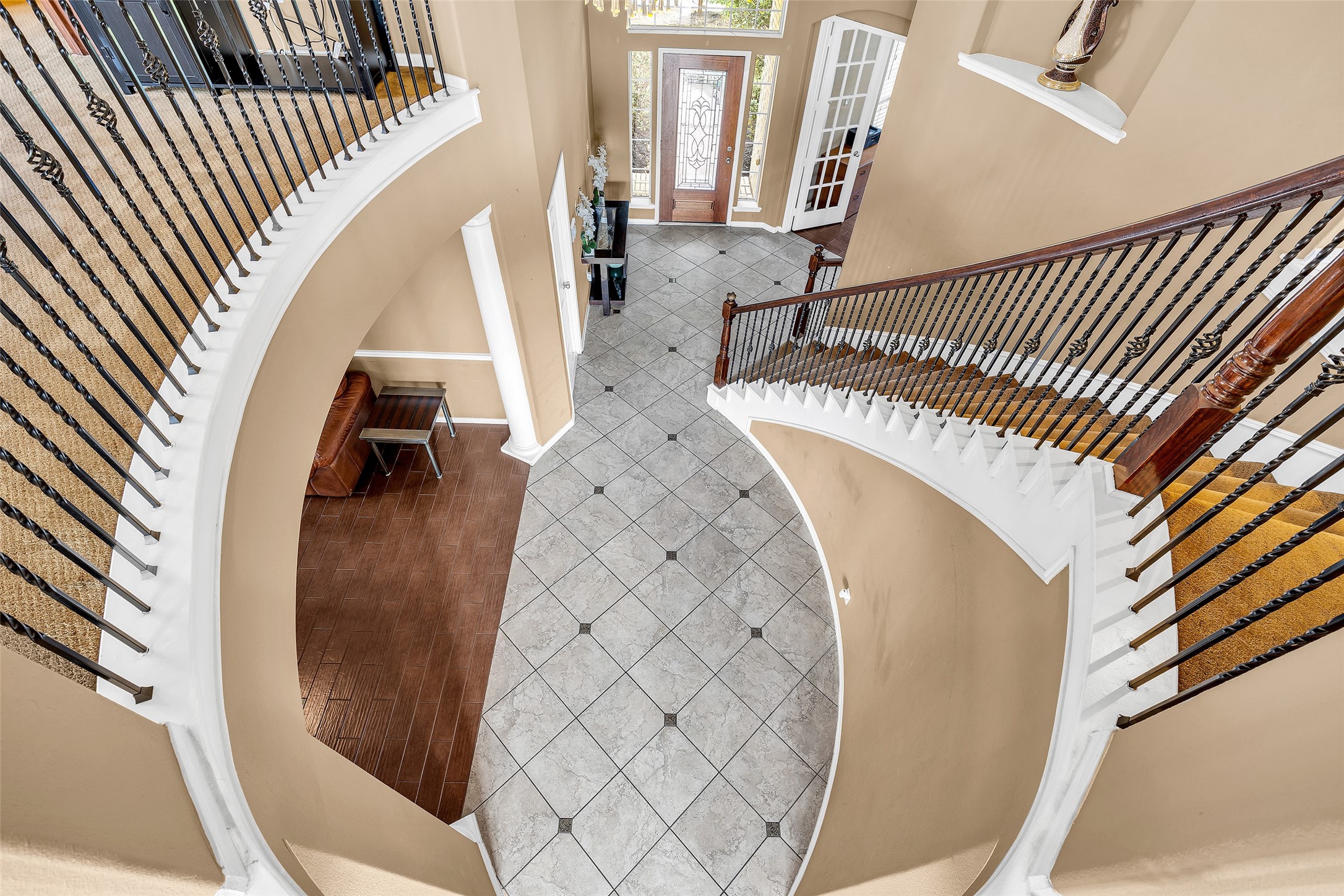 611 River Delta Lane Rosenberg, TX 77469 - Photo 25 of 39 a view of stairs and hall with wooden floor