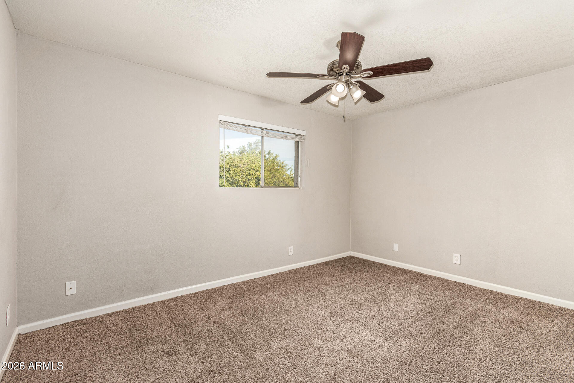 1708 North Daffodil Street Tempe, AZ 85288 - Photo 23 of 34 an empty room with windows and ceiling fan