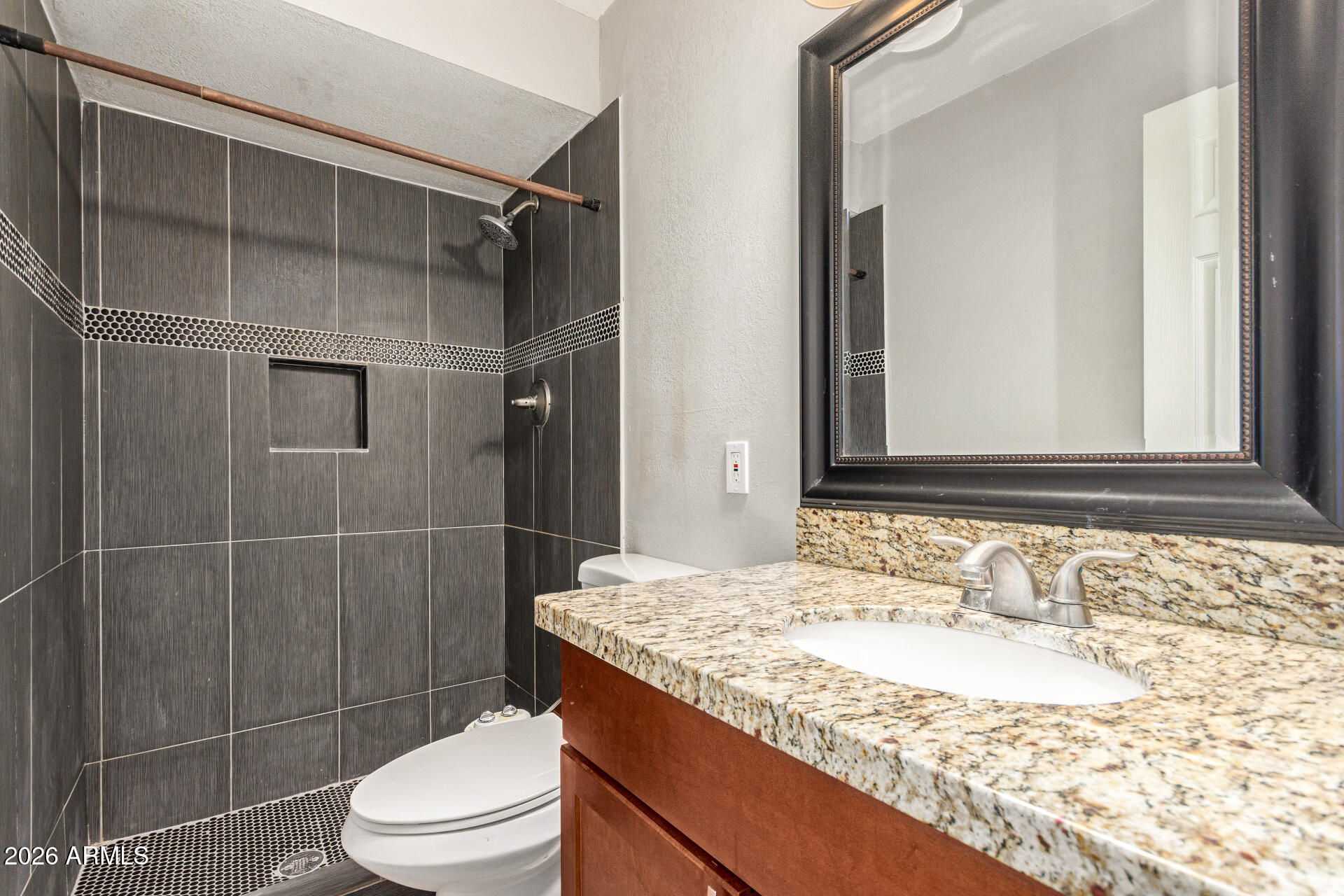 1708 North Daffodil Street Tempe, AZ 85288 - Photo 30 of 34 a bathroom with a granite countertop sink toilet and shower