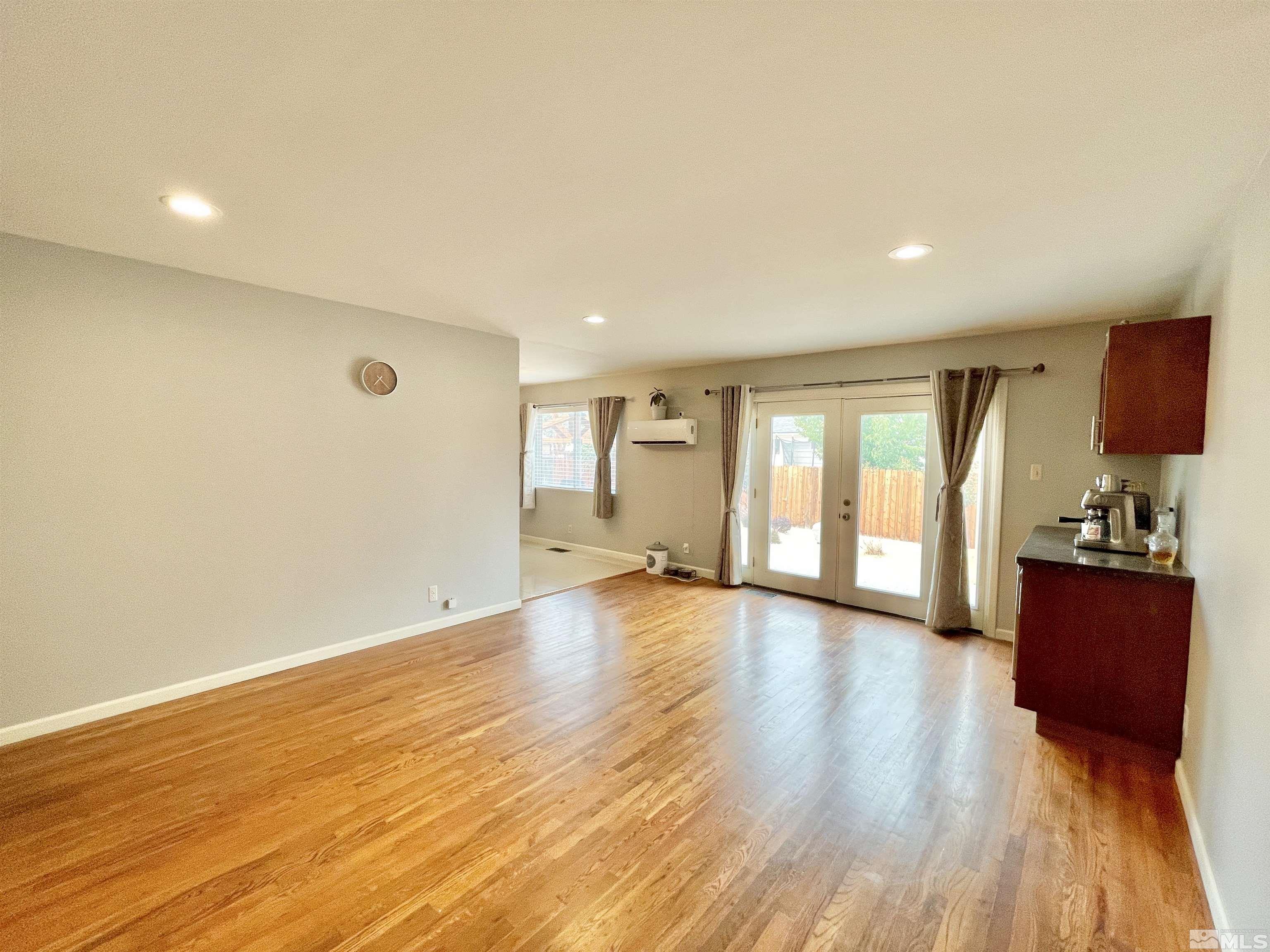 3230 Sandra Drive Reno, NV 89503 - Photo 8 of 25 a view of an empty room with wooden floor and a window