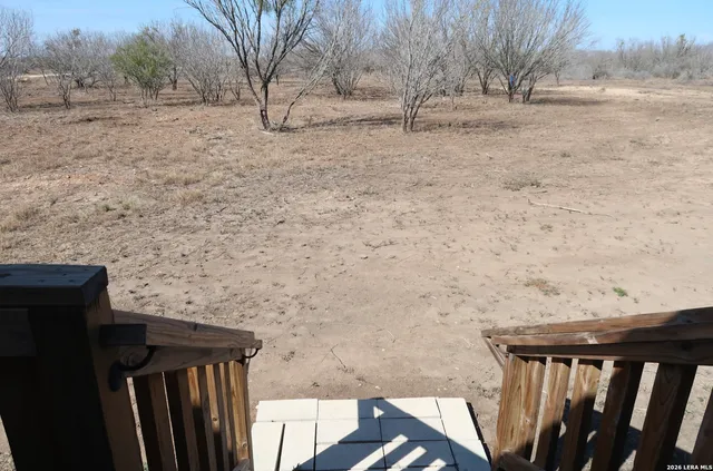 a view of empty room with tree s