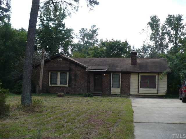 a house with a tree in front of it