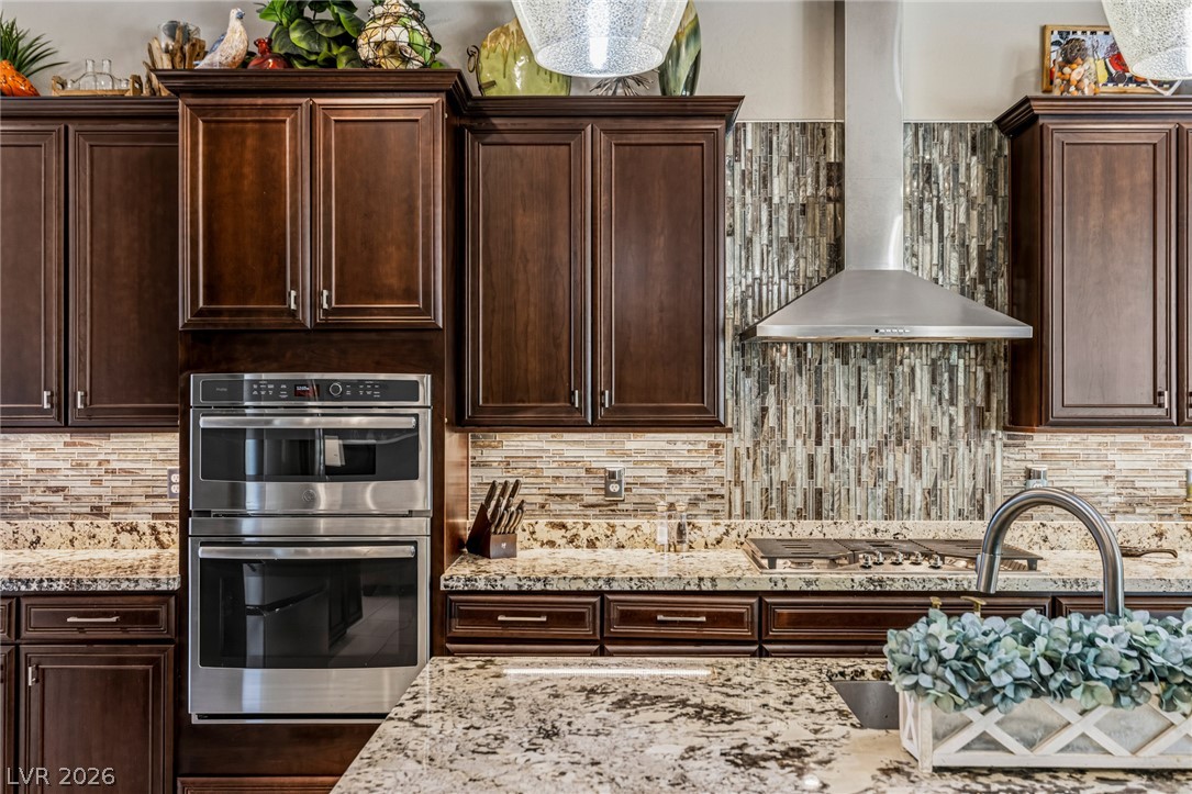 10167 Copper Edge Road Las Vegas, NV 89148 - Photo 10 of 45 Culinary delights await in this chef's kitchen featuring double ovens and granite countertops.