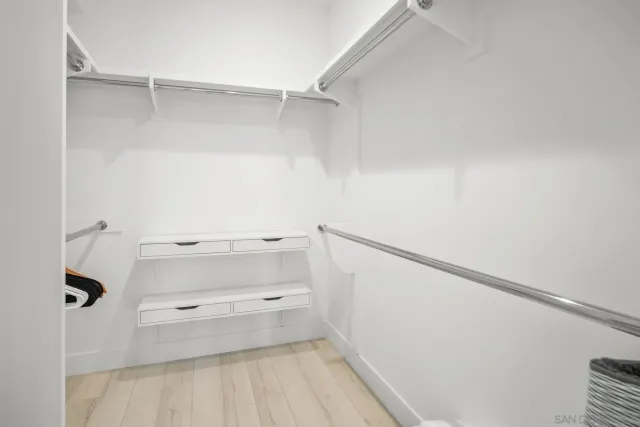 a view of an empty walk in closet