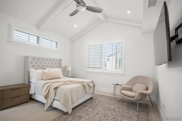 a bedroom with a bed and a chair