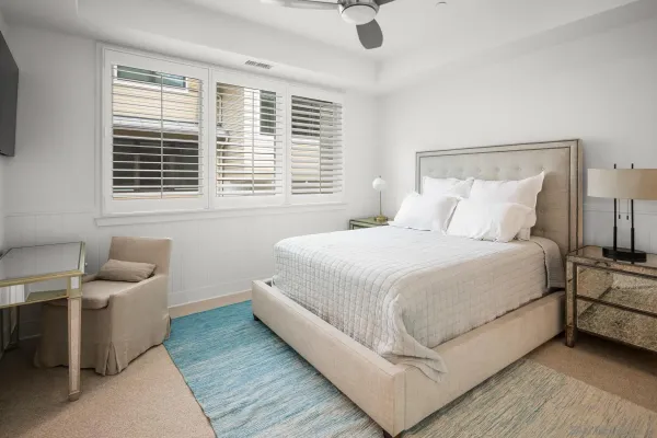 a bedroom with a bed and a couch