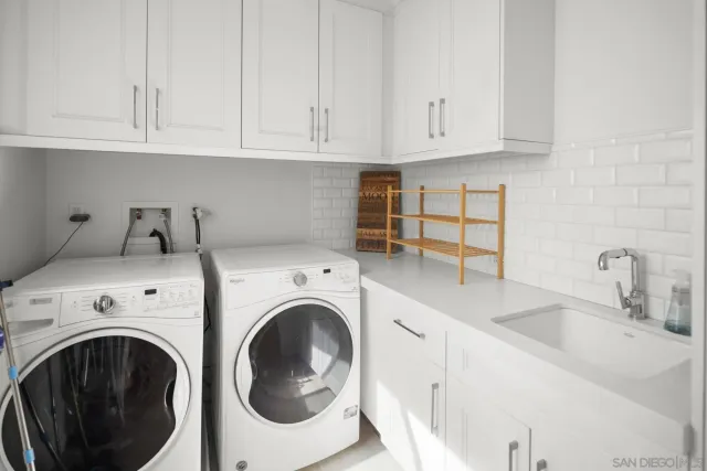 a view of kitchen sink and washer