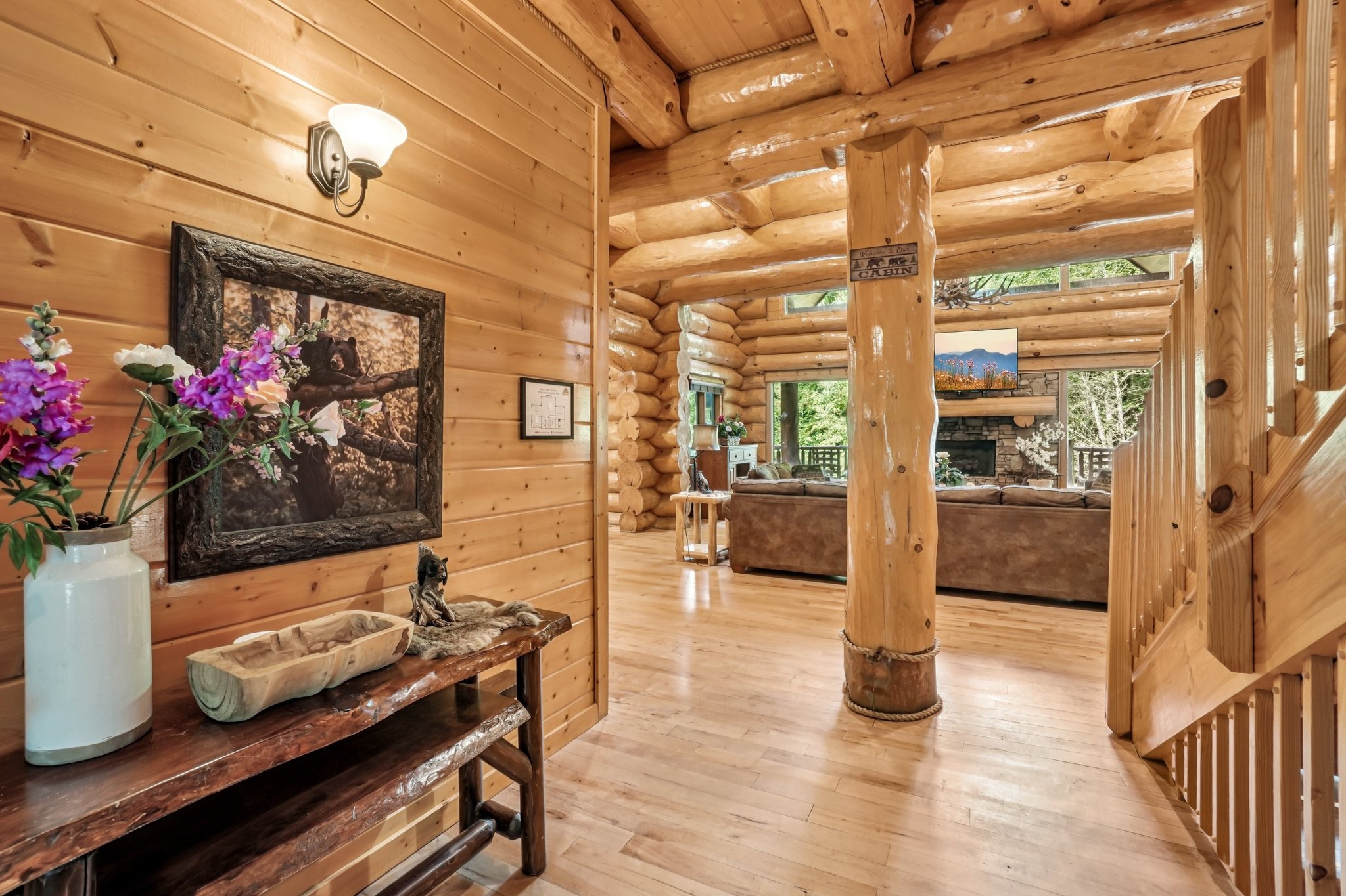 641 Pinnacle Vista Road Gatlinburg, TN 37738 - Photo 19 of 68 a hallway with a dining table and chairs with wooden floor