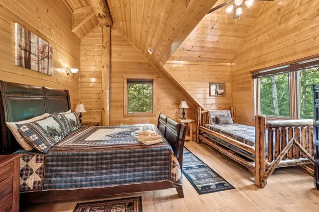 a bedroom with a bed and a dresser