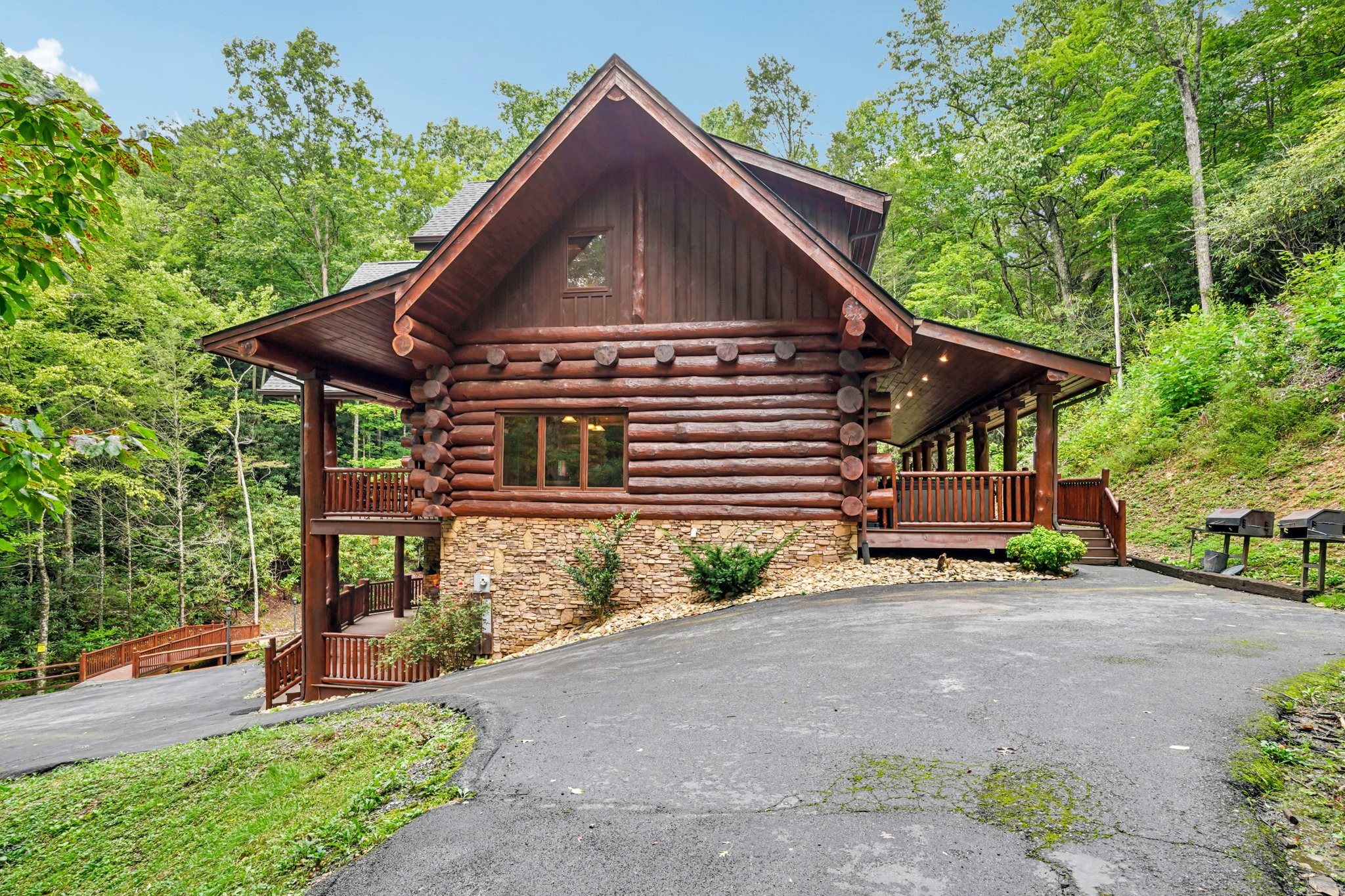 641 Pinnacle Vista Road Gatlinburg, TN 37738 - Photo 3 of 68 a front view of a house with a yard and garage