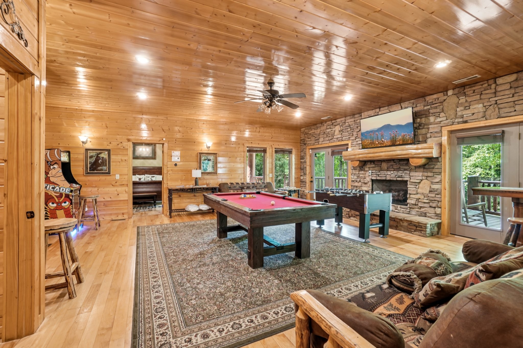 641 Pinnacle Vista Road Gatlinburg, TN 37738 - Photo 37 of 68 a living room with furniture a flat screen tv and a fireplace