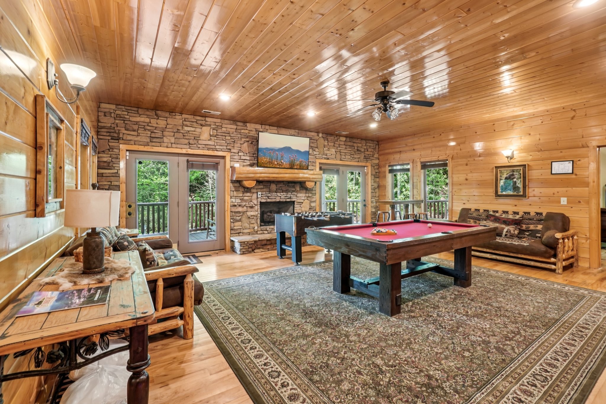 641 Pinnacle Vista Road Gatlinburg, TN 37738 - Photo 38 of 68 a living room with furniture a pool table and a fireplace