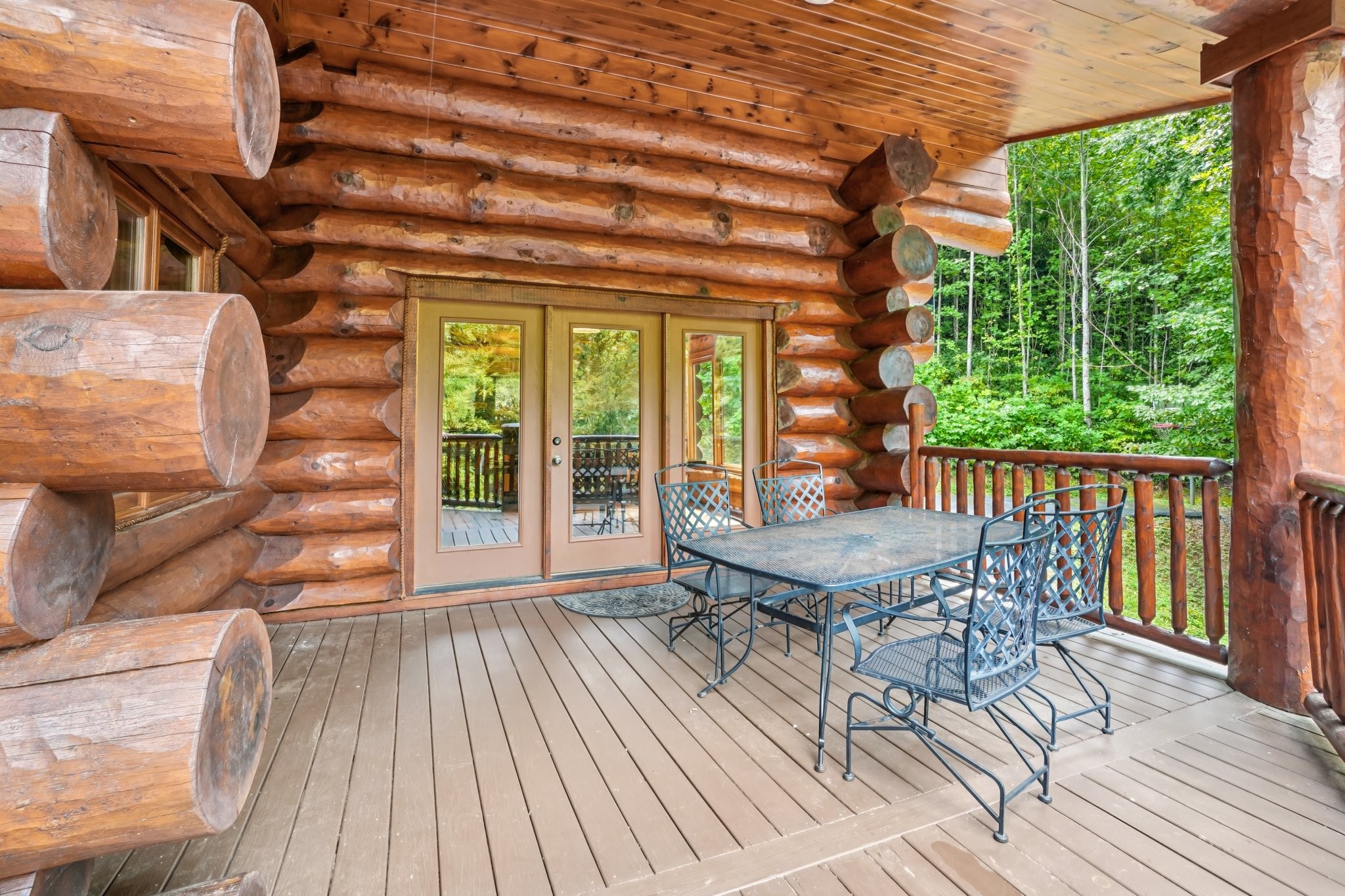 641 Pinnacle Vista Road Gatlinburg, TN 37738 - Photo 50 of 68 a roof deck with table and chairs and wooden floor