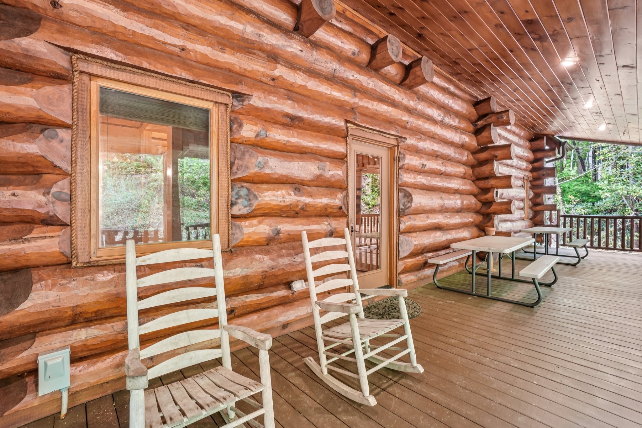 641 Pinnacle Vista Road Gatlinburg, TN 37738 - Photo 55 of 68 a view of patio with a table and chairs and wooden floor
