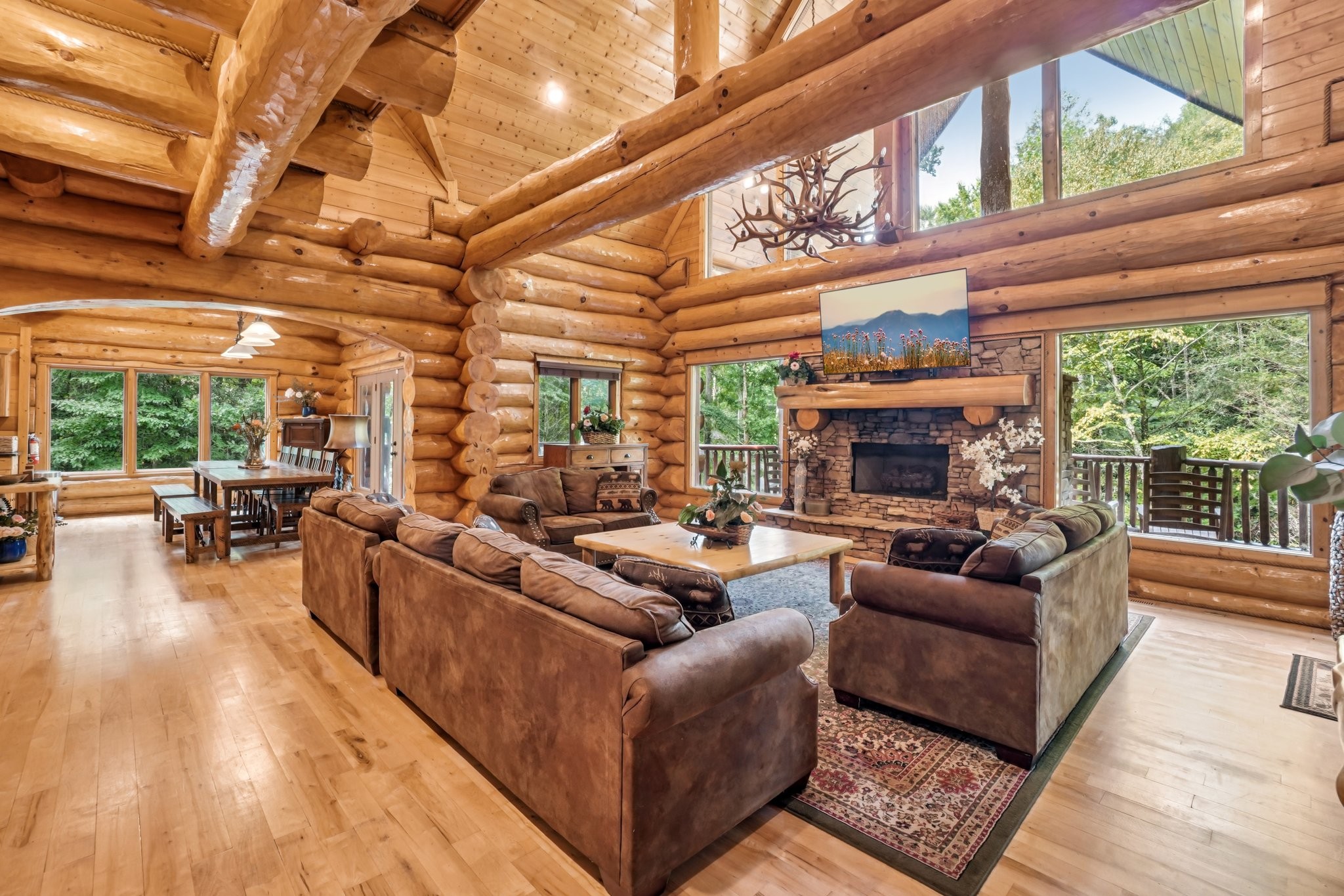 641 Pinnacle Vista Road Gatlinburg, TN 37738 - Photo 9 of 68 a living room with furniture a fireplace and a large window