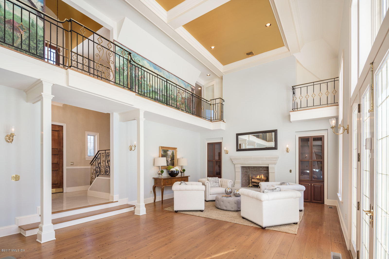6 Andrews Farm Road Greenwich, CT 06831 - Photo 3 of 23 a living room with fireplace furniture and a floor to ceiling window