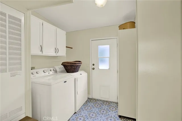 a kitchen with a refrigerator a stove top oven