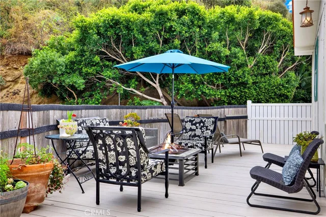 a front view of multi story residential apartment building with yard and sign board