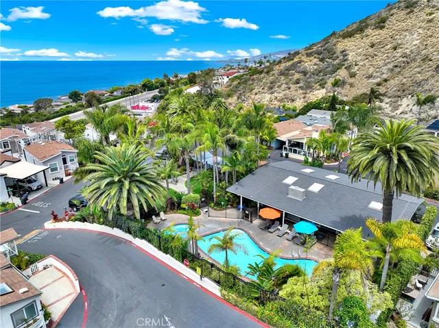 a view of a house with a yard and garage