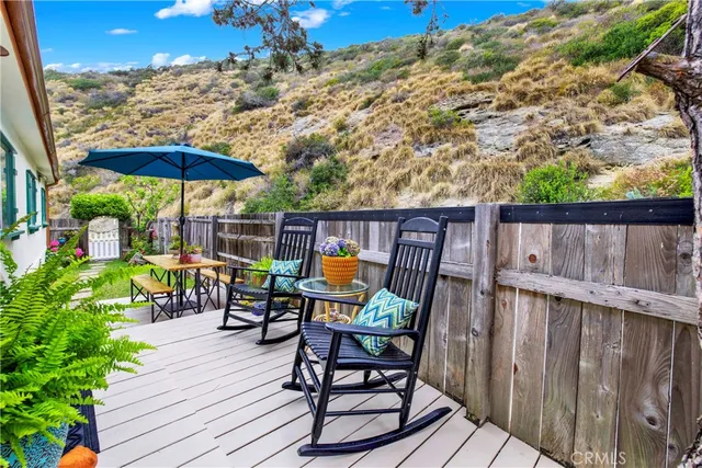 a view of a chairs and table on the wooden floor