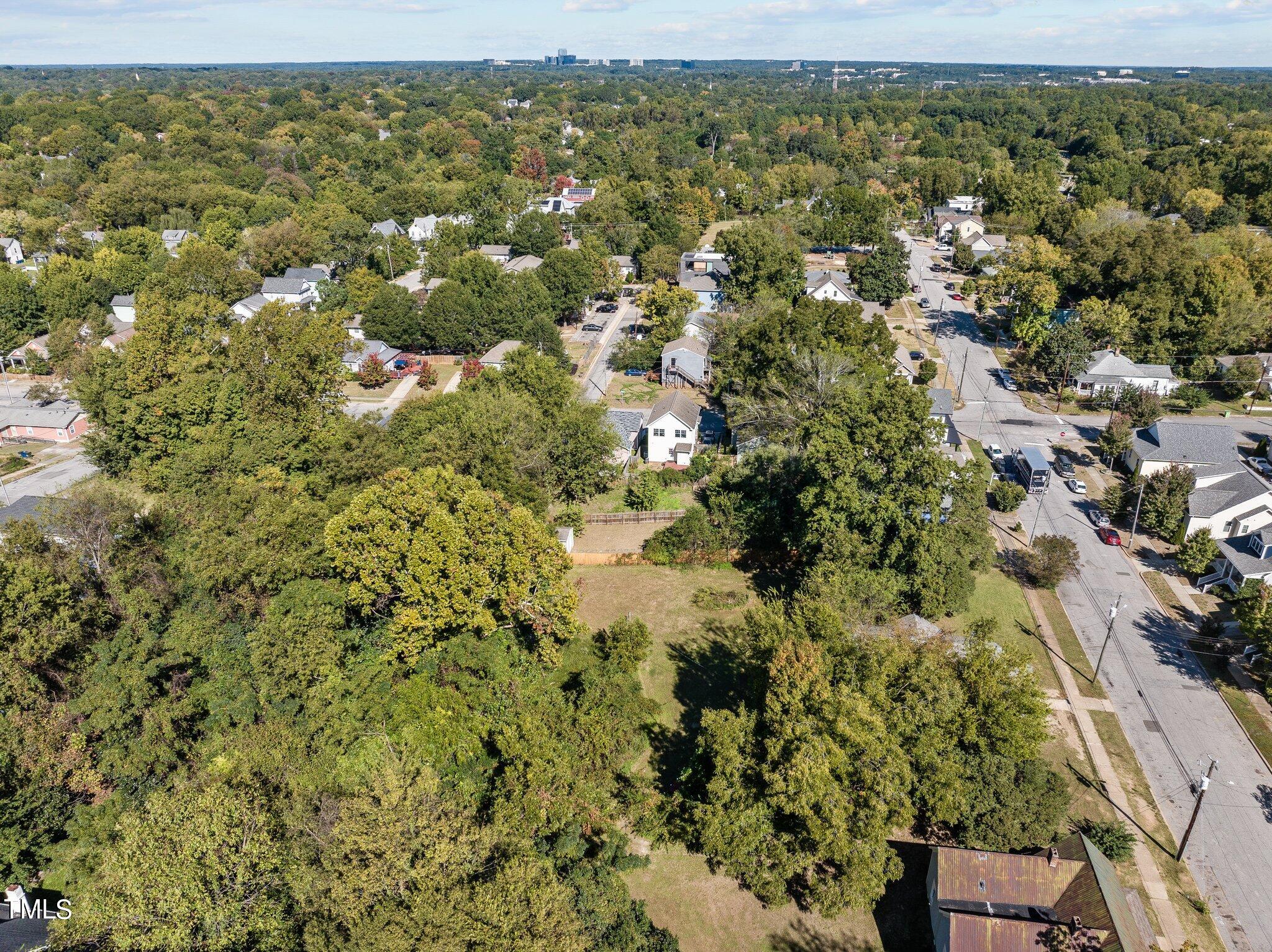 810 East Edenton Street Raleigh, NC 27601 - Photo 28 of 32 an aerial view of residential houses with outdoor space and trees