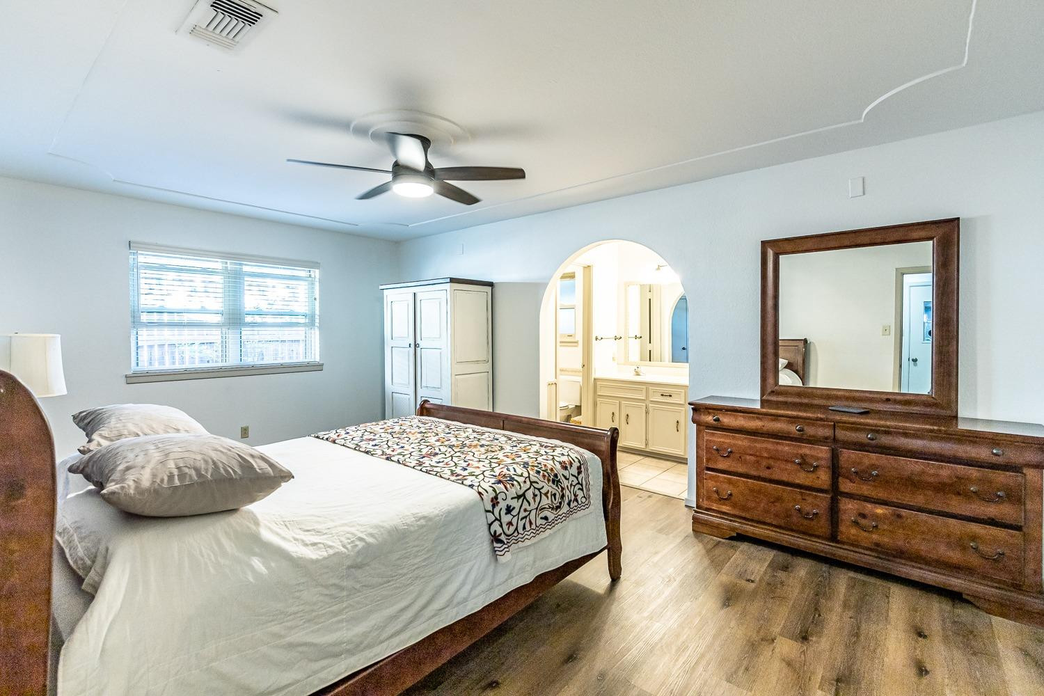 4602 63rd Street Lubbock, TX 79414 - Photo 17 of 37 a bedroom with a large bed and a window