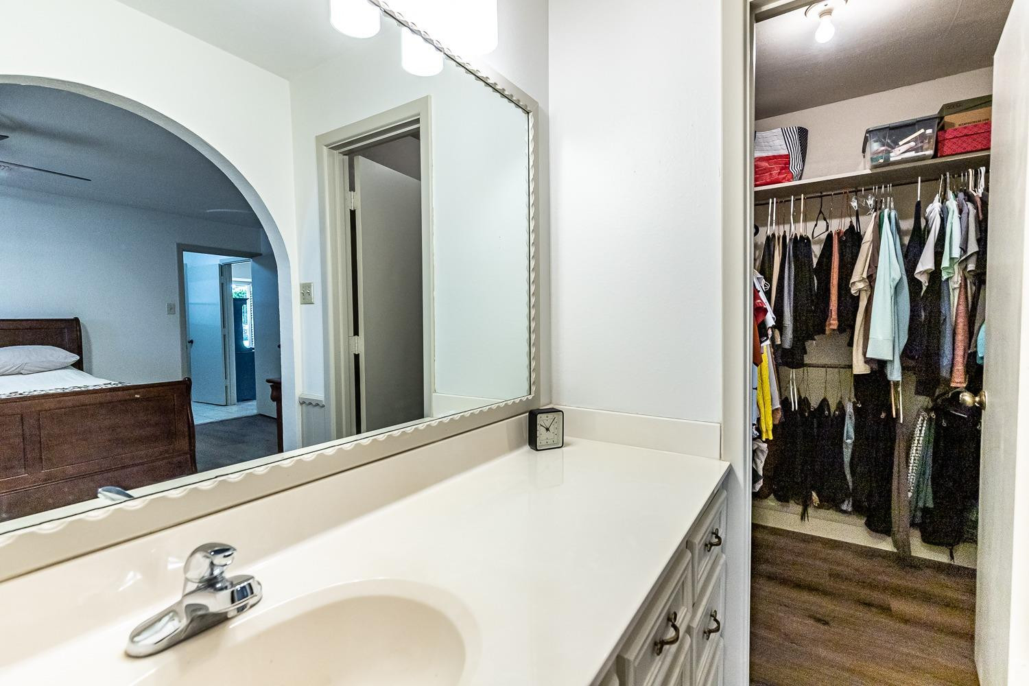 4602 63rd Street Lubbock, TX 79414 - Photo 20 of 37 a bathroom with a sink and a mirror