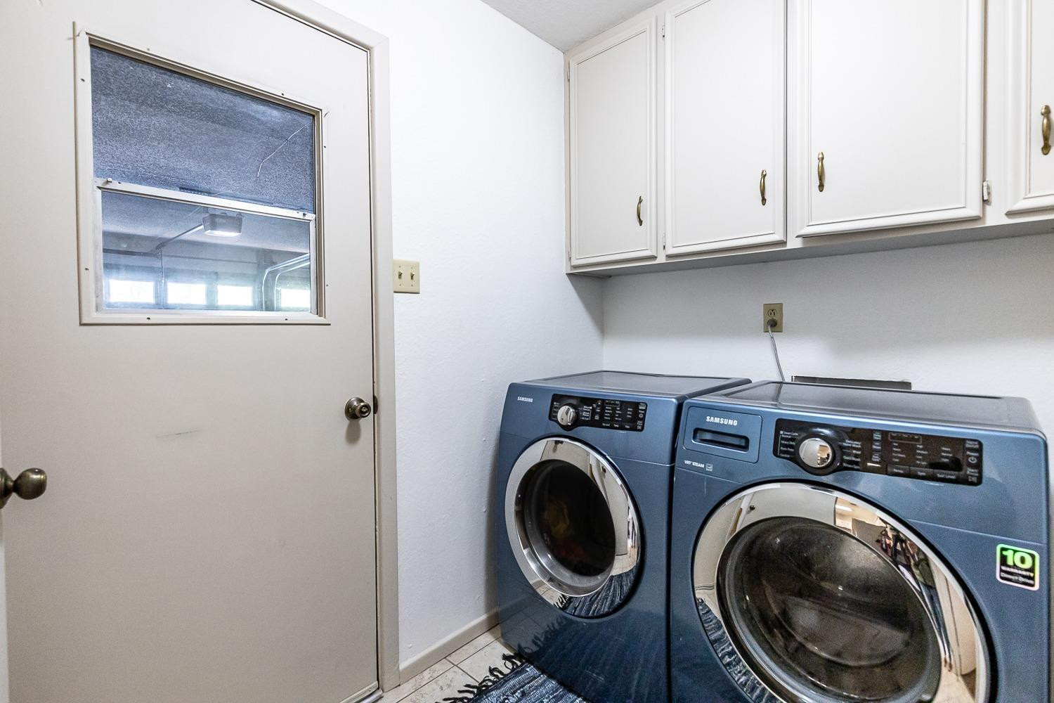 4602 63rd Street Lubbock, TX 79414 - Photo 27 of 37 a utility room with dryer and washer