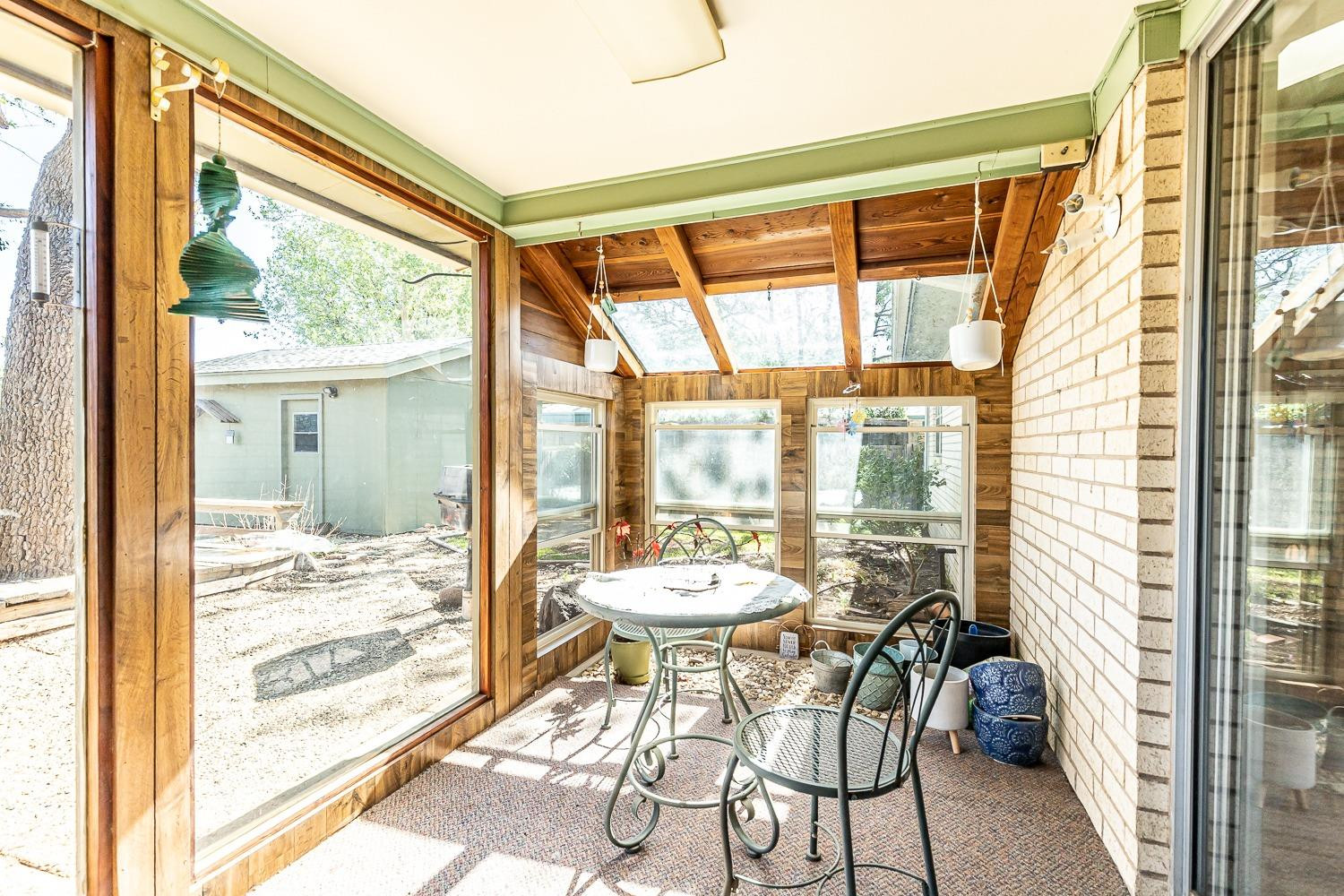4602 63rd Street Lubbock, TX 79414 - Photo 28 of 37 a view of a dining room with a large window and table