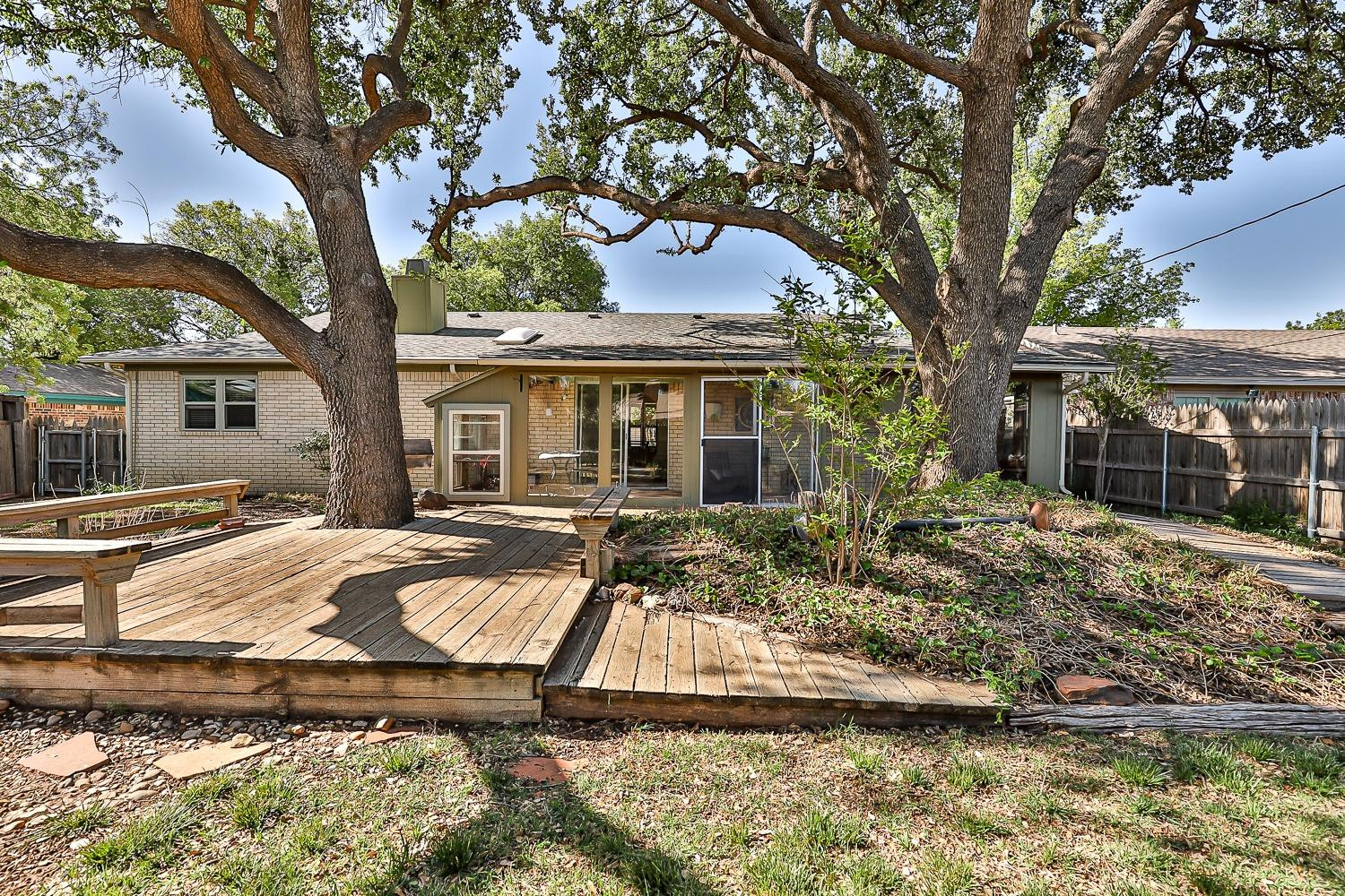 4602 63rd Street Lubbock, TX 79414 - Photo 30 of 37 a front view of house with yard swimming pool and outdoor seating
